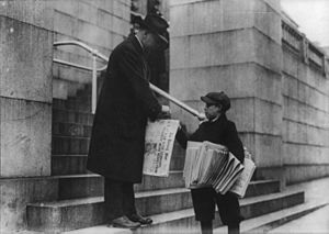 Man buying The Evening Star from newsboy, Washington, D.C. - headline reads "U.S. at War with Germany" LCCN2001706358