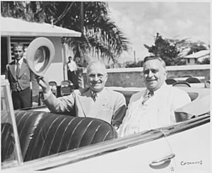 Photograph of President Truman and Governor Jesus Pinero of Puerto Rico in their automobile as their motorcade... - NARA - 200465