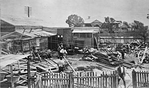 StateLibQld 2 118304 Workers clear a cyclone damaged house at Mackay, 1918