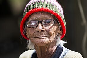 A local citizen of Barranquitas, Puerto Rico, receives food and water delivered to her house on Oct. 17, 2017, after Hurricane Maria affected Puerto Rico 171017-F-KA253-0343 (37132184623)