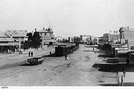 Ellen Street, Port Pirie, and train, about 1900 (SLSA B 55173).jpg
