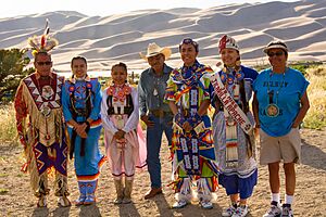Jicarilla Apache Mundo Dancers, Dunes in Background (48390690046)