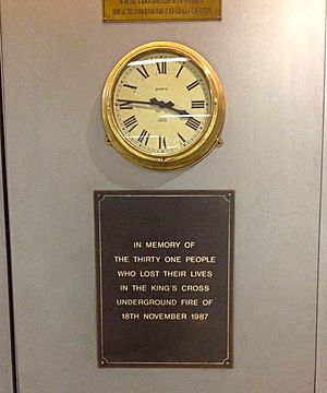 Memorial plaque with clock, King's Cross St. Pancras tube station, London