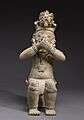 Jama-Coaque - Figure Seated on a Bench with Hands Held to Mouth - Walters 482862