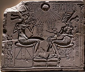 Relief depicting Akhenaton and Nefertiti with three of their daughters under the rays of Aton 01 (cropped)