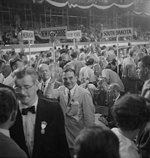 Thomas E. Dewey, Governor of New York, waving from floor of convention hall (cropped)