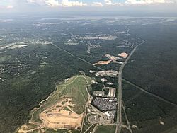 2019-07-22 15 54 55 View south along Virginia State Route 234 (Dumfries Road) toward the Potomac River from an airplane heading for Washington Dulles International Airport passing over Independent Hill, Prince William County, Virginia.jpg