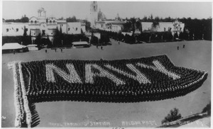 Navy personnel on parade at Balboa Park in Navy flag formation, San Diego, California. - NARA - 295555