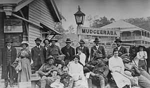StateLibQld 1 14298 People posing at the railway station in Mudgeeraba, ca. 1917