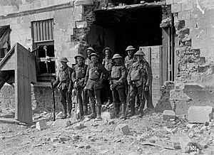 A section of New Zealand Riflemen in newly captured Bapaume, World War I (21613457006)
