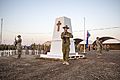 Australian and NZ soldiers present arms during an Anzac Day dawn ceremony at Camp Taji in April 2018