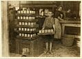 One of the small boys in J. S. Farrand Packing Co. and a heavy load