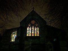 St Edmunds Church, Church Street, Mansfield Woodhouse - Detail of stained glass windows to the Church Street End at dusk 01