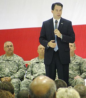 U.S. Governor of Wisconsin Scott Walker in 2011 at troop send-off which will arrive in Kosovo to participate in the NATO-led peacekeeping mission