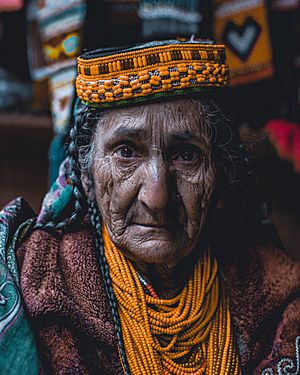 An old Kalash woman in tradational outfit.jpg