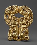 Belt buckle with paired felines attacking ibexes MET DT5088