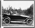 Coeur D'Alene man, Phillip Wildshoe and family, in his Chalmers automobile LCCN90710980