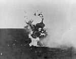 Kamikaze hits USS Columbia (CL-56) in Lingayen Gulf on 6 January 1945 (NH 79450)
