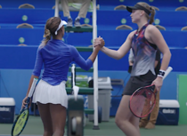 Osuigwe and Rybakina shake hands