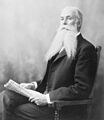 Sanford B. Dole holding newspaper