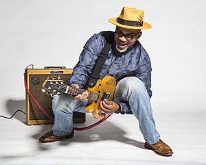 Toronzo Cannon plays guitar through legs.jpg