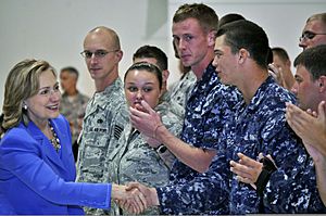 U.S. Secretary of State Hillary Rodham Clinton, left, greets Service members after her speech at Andersen Air Force Base, Guam 101029-N-QE566-002