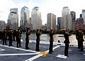 US Navy 091102-N-2147L-001(1) Marines assigned to Special Purpose Marine Air-Ground Task Force 26 fire a 21-gun salute as the amphibious transport dock ship Pre-commissioning Unit (PCU) New York (LPD 21) passes Ground Zero
