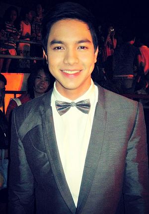 A closeup of Alden Richards smiling at the camera.
