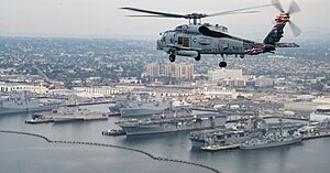 An MH-60R Sea Hawk helicopter flies over San Diego. (24546100368) (cropped)