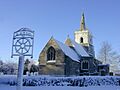 Coton church and village sign