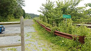 Sign denoting Overall, Virginia, at the end of the demolished bridge (Page County Bridge No. 1004) over Jeremiah's Run.