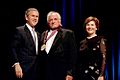 President George W. Bush and Laura Bush stand with Johnny Cash