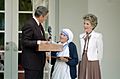 President Ronald Reagan presents Mother Teresa with the Medal of Freedom at a White House Ceremony in the Rose Garden
