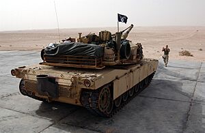 US Navy 031214-N-3236B-008 A Marine from the 13th Marine Expeditionary Unit (13th MEU) Tank Platoon BLT 1-1 stationed at Twentynine Palms, Calif., directs an M1-A1 Abrams tank during a training exercise