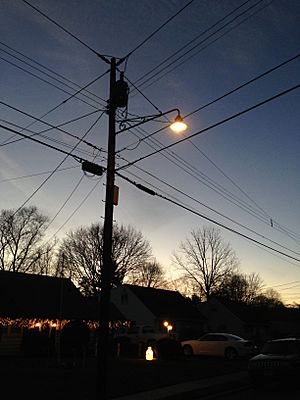 2014-12-26 17 01 34 Incandescent street light just after turning on for the night on Fireside Avenue at Meridan Avenue in Ewing, New Jersey
