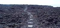 Stepping stones on footpath across lava field