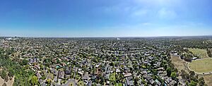 Aerial panorama of Heidelberg facing west towards the Dandenongs. February 2024