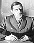 Commander of Free French Forces Charles de Gaulle seated (cropped).jpg