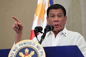 Duterte delivers his message to the Filipino community in Vietnam during a meeting held at the Intercontinental Hotel on September 28