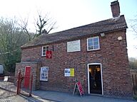 The brick tollhouse at the south end of the bridge