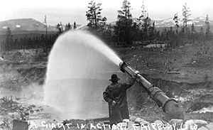 Placer Mines, worker steaming water to assist with mining operations, early 1900s - DPLA - d69dee0966eca12491731817b30ee312