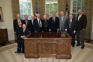 President George W. Bush and Senator Ted Stevens welcome World War II veterans of the 322nd Troop Carrier Squadron (87)