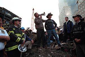 President George W. Bush rallies firefighters and rescue workers during an impromptu speech at the site of the collapsed World Trade Center