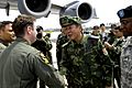 Senior Capt. Guan Youfei greets the first of two U.S. aircrews delivering earthquake relief supplies (080518-F-9750V-001)