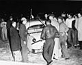 White men and Robeson County indians (Lumbee Indians) in crowd with a car and guns (State's Exhibit No.5). Photo taken by Bill Shaw, Fayetteville Observer newspaper photographer. Photo used as state's (8223346871)
