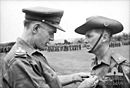 Phuoc Tuy, Vietnam. 1967-01. Major Harry Smith of St. John's Wood, Brisbane, Qld, receiving the ribbon to the Military Cross for gallantry from Brigadier O. D. Jackson.