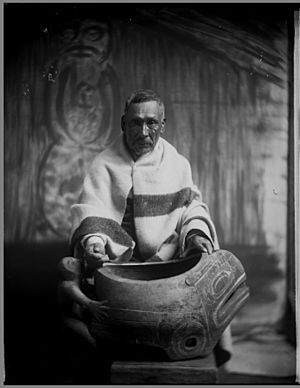 Quatsino man with carved ceremonial bowl VPL 14057