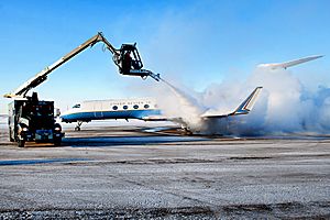 A U.S. Army C-37B aircraft transporting Army Chief of Staff Gen. Raymond T. Odierno, gets de-iced before it departs Joint Base Elmendorf-Richardson, Alaska