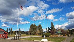 Aroostook Valley Country club entrance showing US and Canadian flags