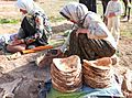 Baking bread by nomad women in Lar National Park